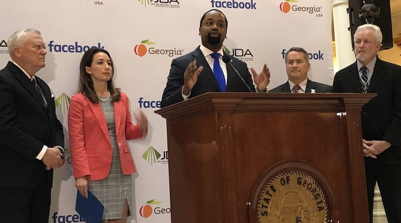 Reginald McKnight, center, Facebook’s head of U.S. economic development policy, speaks Wednesday during a press conference to announce the social giant’s new data center in Social Circle. J. Scott Trubey/strubey@ajc.com