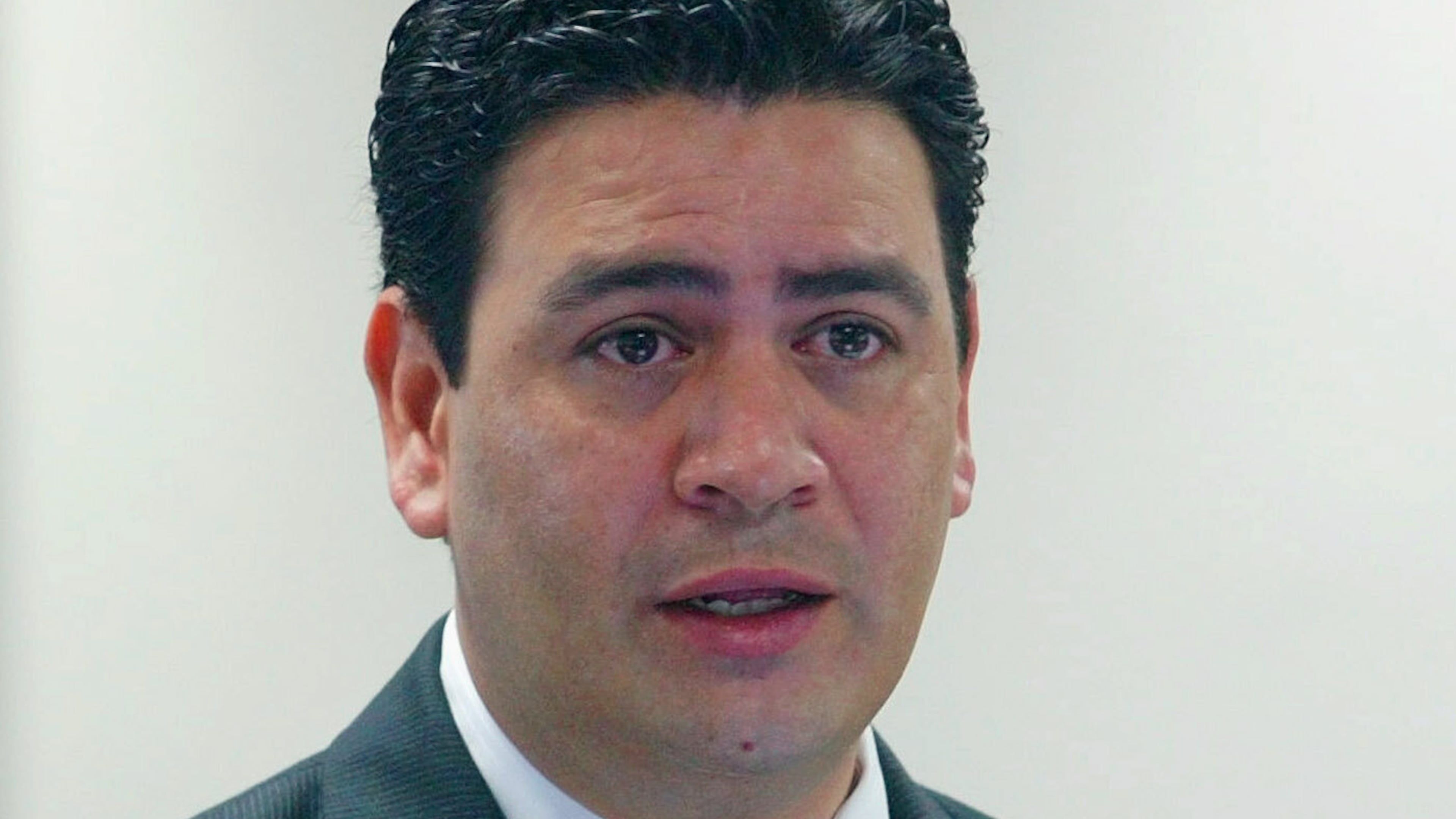 FILE - David Herrera Urias, attorney for plaintiffs, questions a witness during a trial Aug. 26, 2004, in Austin, Texas. (AP Photo/Harry Cabluck, File)