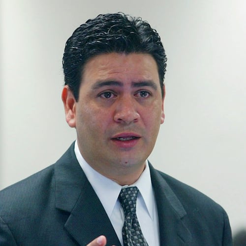 FILE - David Herrera Urias, attorney for plaintiffs, questions a witness during a trial Aug. 26, 2004, in Austin, Texas. (AP Photo/Harry Cabluck, File)