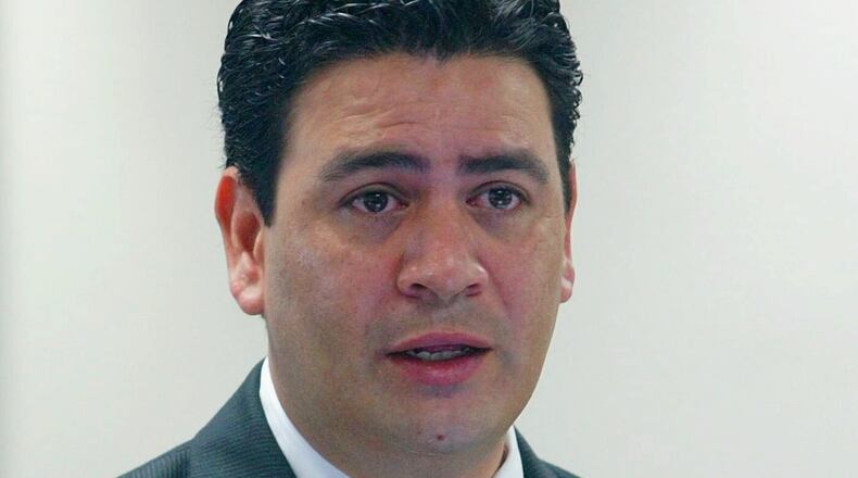 FILE - David Herrera Urias, attorney for plaintiffs, questions a witness during a trial Aug. 26, 2004, in Austin, Texas. (AP Photo/Harry Cabluck, File)