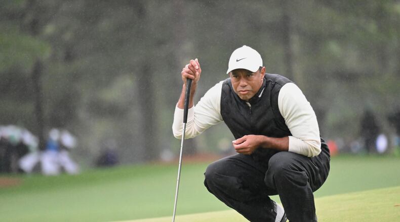 Tiger Woods lines up putt on 17th green during second round of the 2023 Masters Tournament at Augusta National Golf Club, Saturday, April 8, 2023, in Augusta, Ga. (Hyosub Shin / Hyosub.Shin@ajc.com)