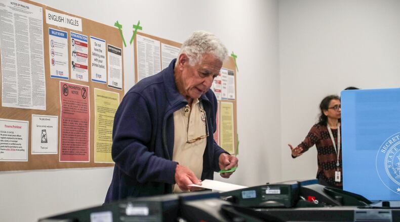 Hartley Falbaum of Loganville casts his ballot during early voting for the presidential primary at the Gwinnett County Voter Registrations and Elections office building in Lawrenceville, Monday, March 2, 2020. (Alyssa Pointer/AJC)