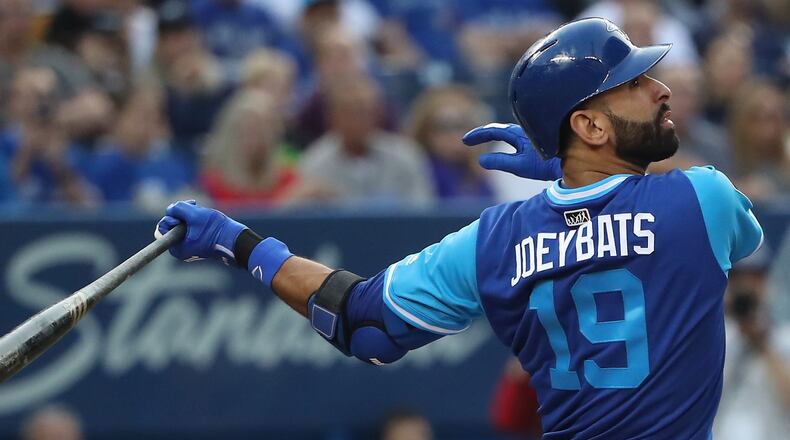 Jose Bautista  flies out in the first inning during against the Minnesota Twins at Rogers Centre Aug. 25, 2017, in Toronto.