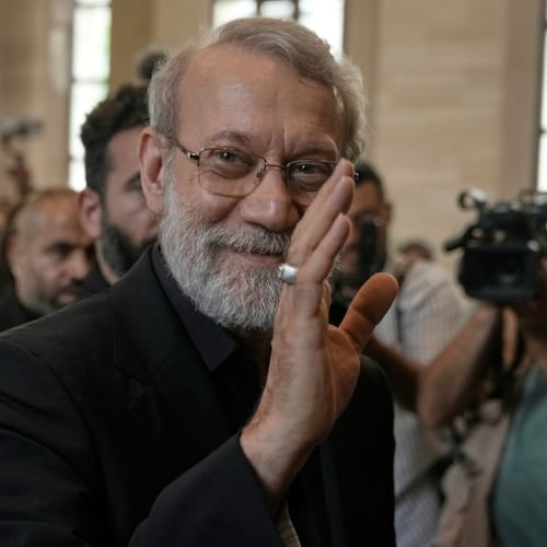 FILE - Iranian Secretary of Supreme National Security Council Ali Larijani, greets journalists upon his arrival to meet with the Lebanese parliament speaker Nabih Berri, in Beirut, Lebanon, Wednesday, Aug. 13, 2025. (AP Photo/Bilal Hussein, File)