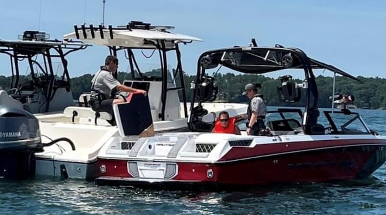 Georgia DNR officers paused their dayslong search for a missing man in Lake Lanier to chase down a stolen ski boat valued at more than $100,000, officials said.