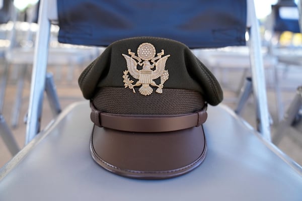 Col. J.D. Evans' hat sits on a chair during a ceremony at Fort Benning, honoring new namesake on Wednesday, April 16, 2025, in Fort Benning, Ga. (AP Photo/Brynn Anderson)