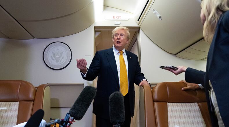 President Donald Trump speaks with reporters in flight on Air Force One after landing at U.S. Air Force Base at RAF Mildenhall, in Suffolk, Eastern England, Wednesday, July 8, 2026. (AP Photo/Alex Brandon)