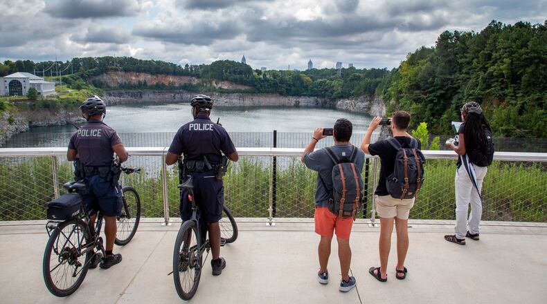 People stop and take in the scenic overlook at Westside Park. STEVE SCHAEFER FOR THE ATLANTA JOURNAL-CONSTITUTION