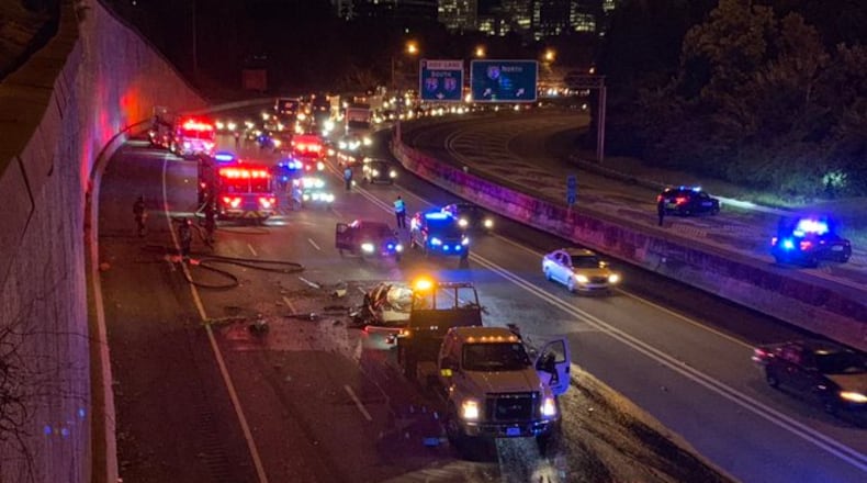 All northbound lanes of the Downtown Connector were blocked at about 3:30 a.m. to clear the charred vehicle.