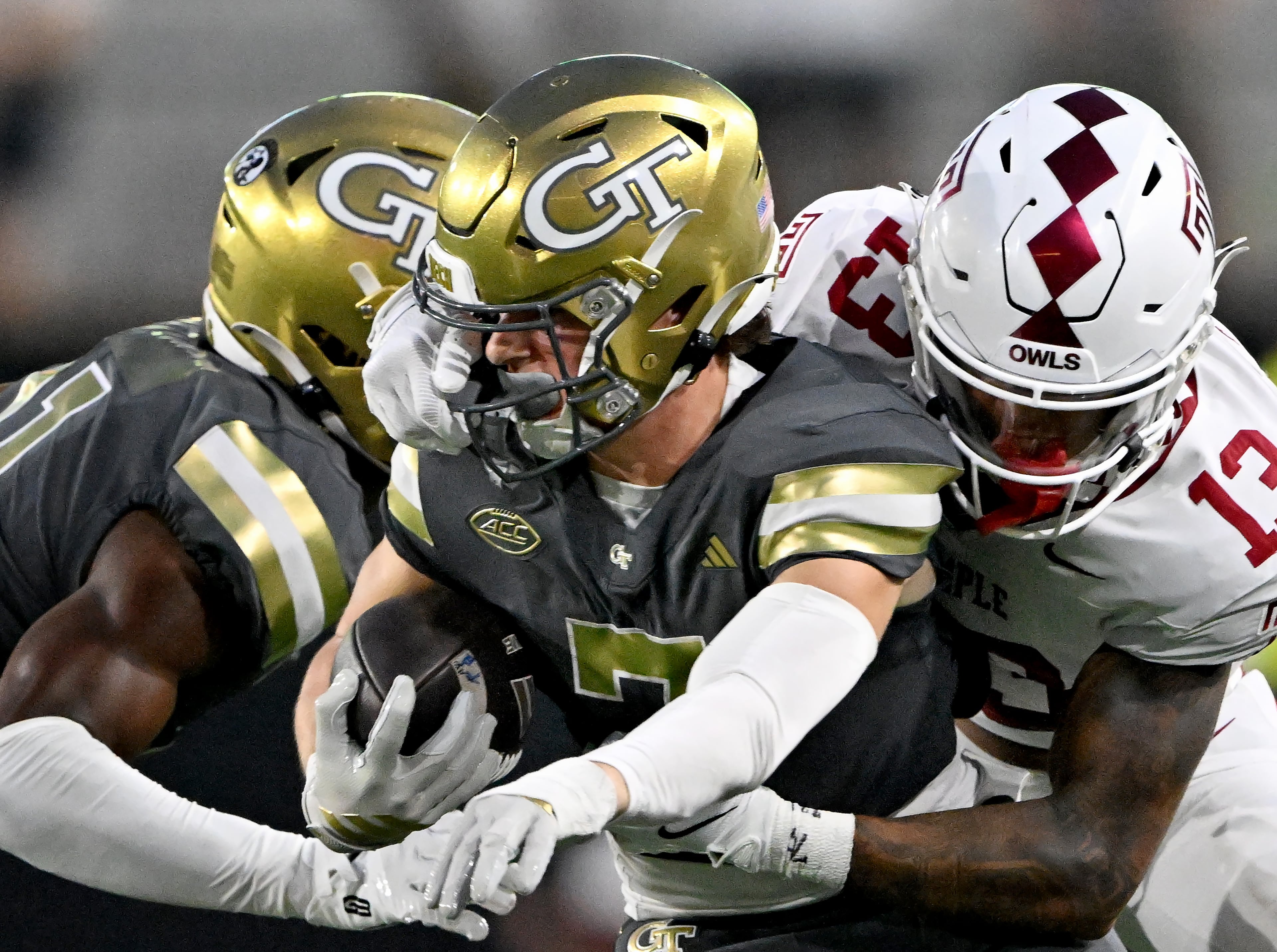 Georgia Tech wide receiver Bailey Stockton (7) gets tackled behind by Temple cornerback Denzel Chavis (13) during the second half of an NCAA college football game at Georgia Tech's Bobby Dodd Stadium, Saturday, November 20, 2025 in Atlanta. Georgia Tech won 45-24 over Temple. (Hyosub Shin / AJC)