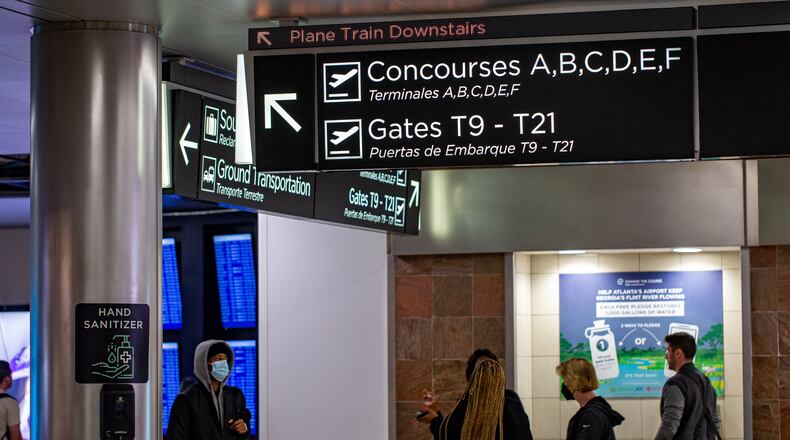 Hartsfield-Jackson Atlanta International Airport expands for the first time in a decade with the addition of five passenger gates on Concourse T.  Updated signage shows the addition of gates T17 - T21 on Thursday, Nov 17, 2022.  The area's circular atrium skylight, lounge seating options, large windows and digital information boards provide for United passengers.  (Jenni Girtman for The Atlanta Journal-Constitution)
