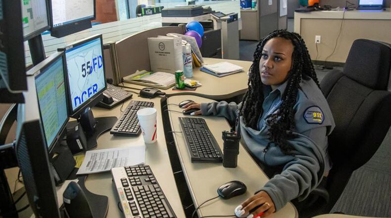 Operator Kelah Handley answers calls at Sandy Springs’ 911 dispatch center. The City Council has awarded a $198,334 contract to build a back-up 911 center on the fourth floor of City Hall. STEVE SCHAEFER / SPECIAL TO THE AJC