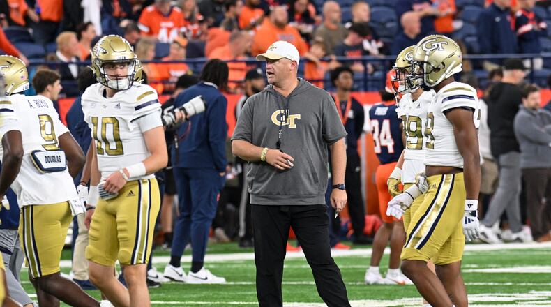 Georgia Tech head coach Brent Key instructs his players during the first half of an NCAA football game against Syracuse, Saturday, Sept. 7, 2024 in Syracuse, N.Y. (AP Photo/Hans Pennink)