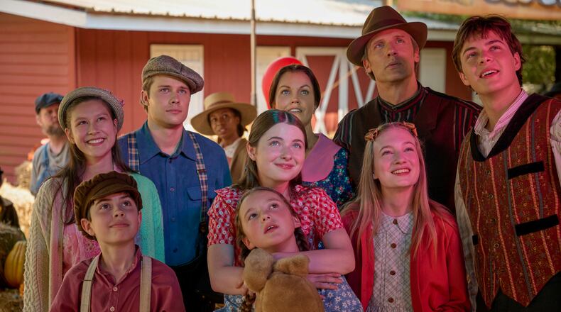 Vivian Lee-Boulton as Edith (from left, back row), Logan Shroyer as John Boy Walton, Bellamy Young as Olivia Walton, Teddy Sears as John Walton, Christian Finlayson as Jason Walton; Samuel Goergon as Jim Bob Walton (from left, front row), Marcelle LeBlanc as Mary Ellen Walton, Tatum Sue Matthews as Erin Walton, and Callaway Corrick as Elizabeth Walton in "A Waltons Thanksgiving."