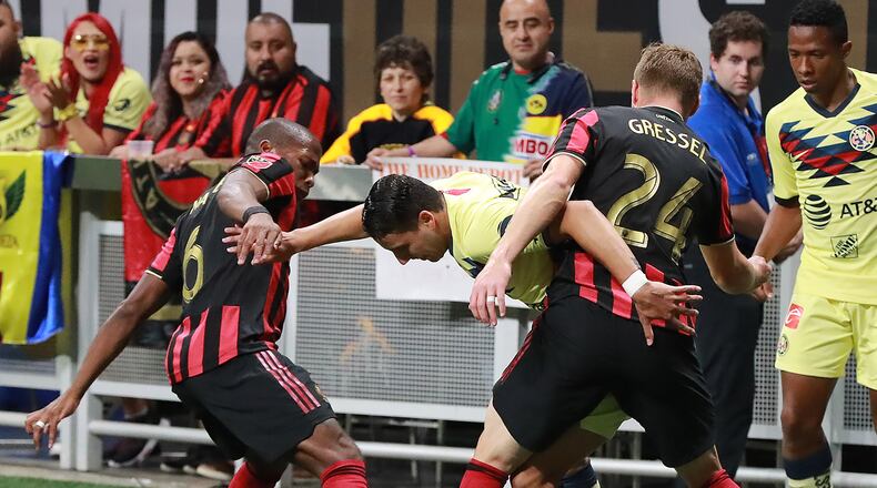 August 14, 2019 Atlanta: Atlanta United players Darlington Nagbe (left) and Julian Gressel defend against Club America defender Jorge Sanchez in the Campeones Cup on Wednesday, August 14, 2019, in Atlanta. Curtis Compton/ccompton@ajc.com