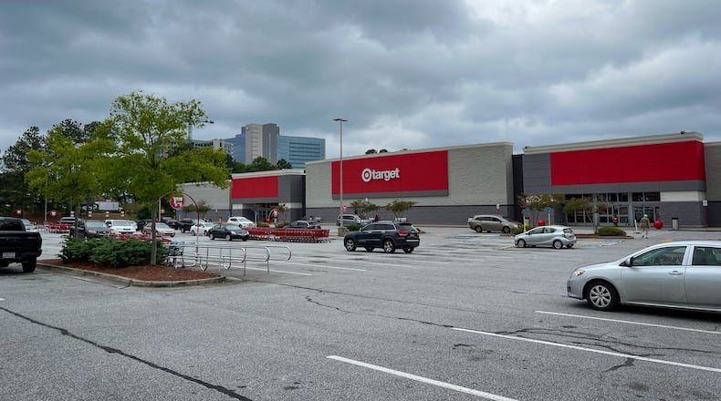 A Target store on North Druid Hills Road was closed temporarily Thursday afternoon after someone set fire in one of the dressing rooms, Brookhaven police said.