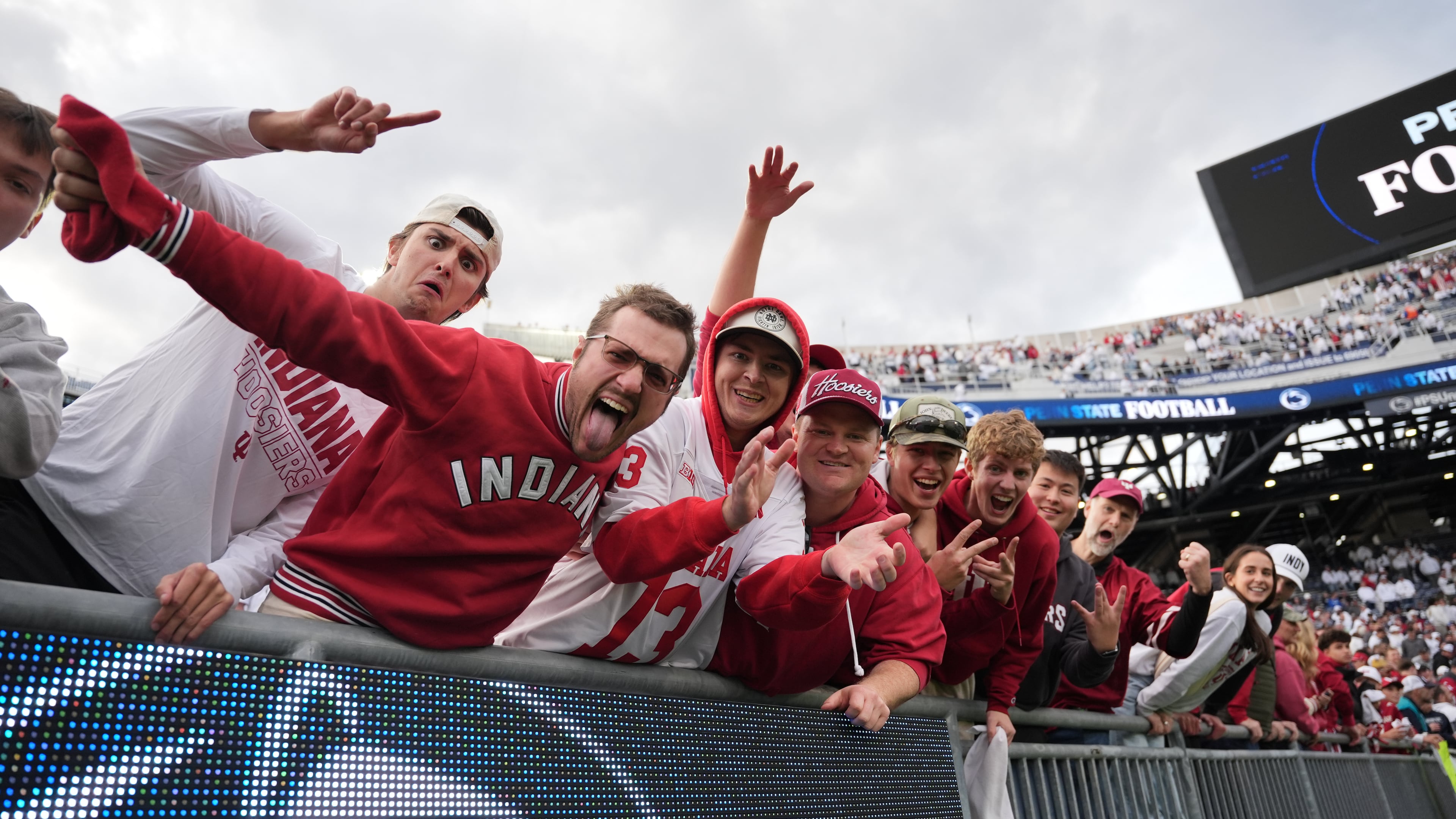 Indiana fans celebrate following an NCAA college football game against Penn State, Saturday, Nov. 8, 2025, in State College, Pa. (AP Photo/Sam Balkansky)