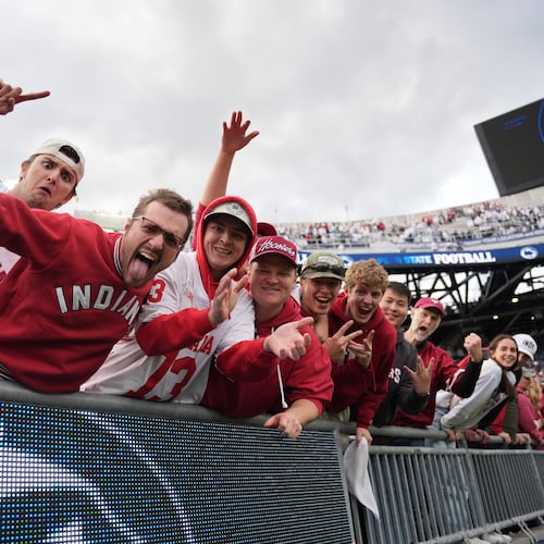 Indiana fans celebrate following an NCAA college football game against Penn State, Saturday, Nov. 8, 2025, in State College, Pa. (AP Photo/Sam Balkansky)