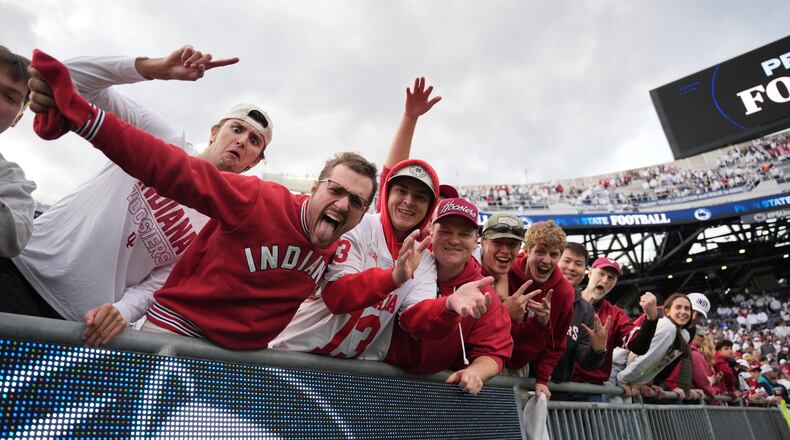 Indiana fans celebrate following an NCAA college football game against Penn State, Saturday, Nov. 8, 2025, in State College, Pa. (AP Photo/Sam Balkansky)