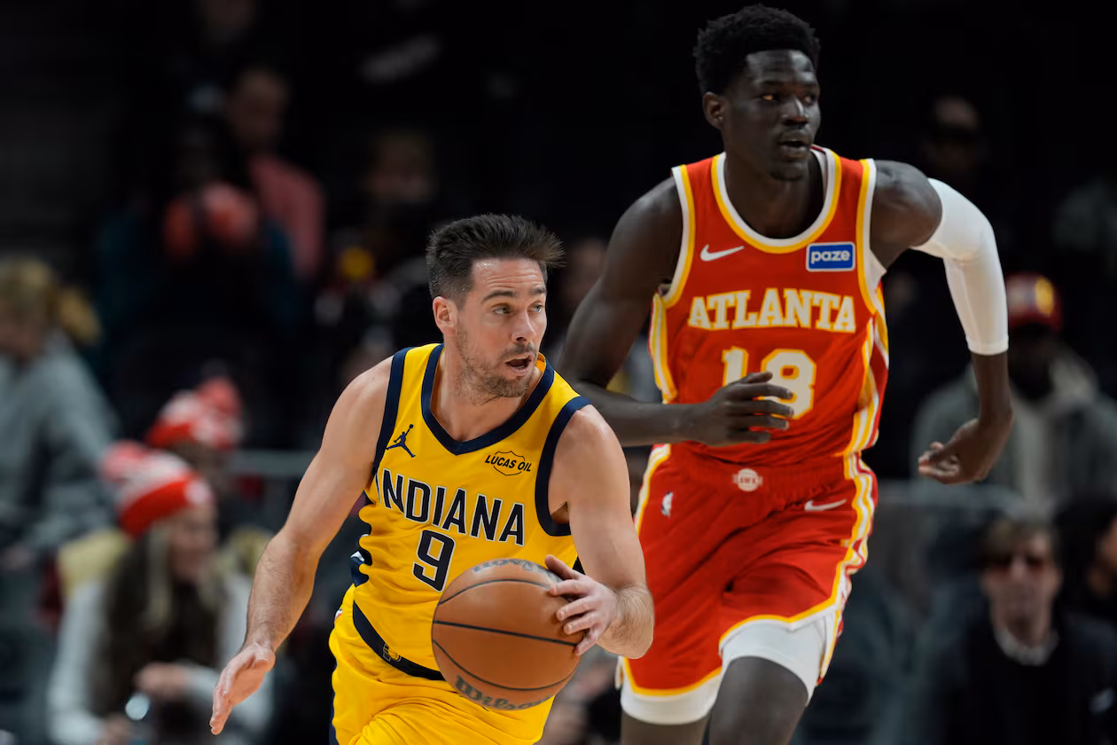 Indiana Pacers guard T.J. McConnell (9) moves against Atlanta Hawks forward Mouhamed Gueye (18) during the first half of an NBA basketball game, Monday, Jan. 26, 2026, in Atlanta. (AP Photo/Mike Stewart)