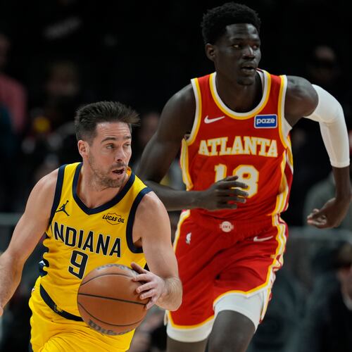 Indiana Pacers guard T.J. McConnell (9) moves against Atlanta Hawks forward Mouhamed Gueye (18) during the first half of an NBA basketball game, Monday, Jan. 26, 2026, in Atlanta. (AP Photo/Mike Stewart)