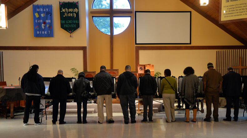 7:09:54 AM All voting machines are filled as a steady stream of voters comes in to cast their ballots at the polling place at the Crossroads Presbyterian Church in Stone Mountain early on Election Day, Tuesday, November 4, 2014. KENT D. JOHNSON/KDJOHNSON@AJC.COM