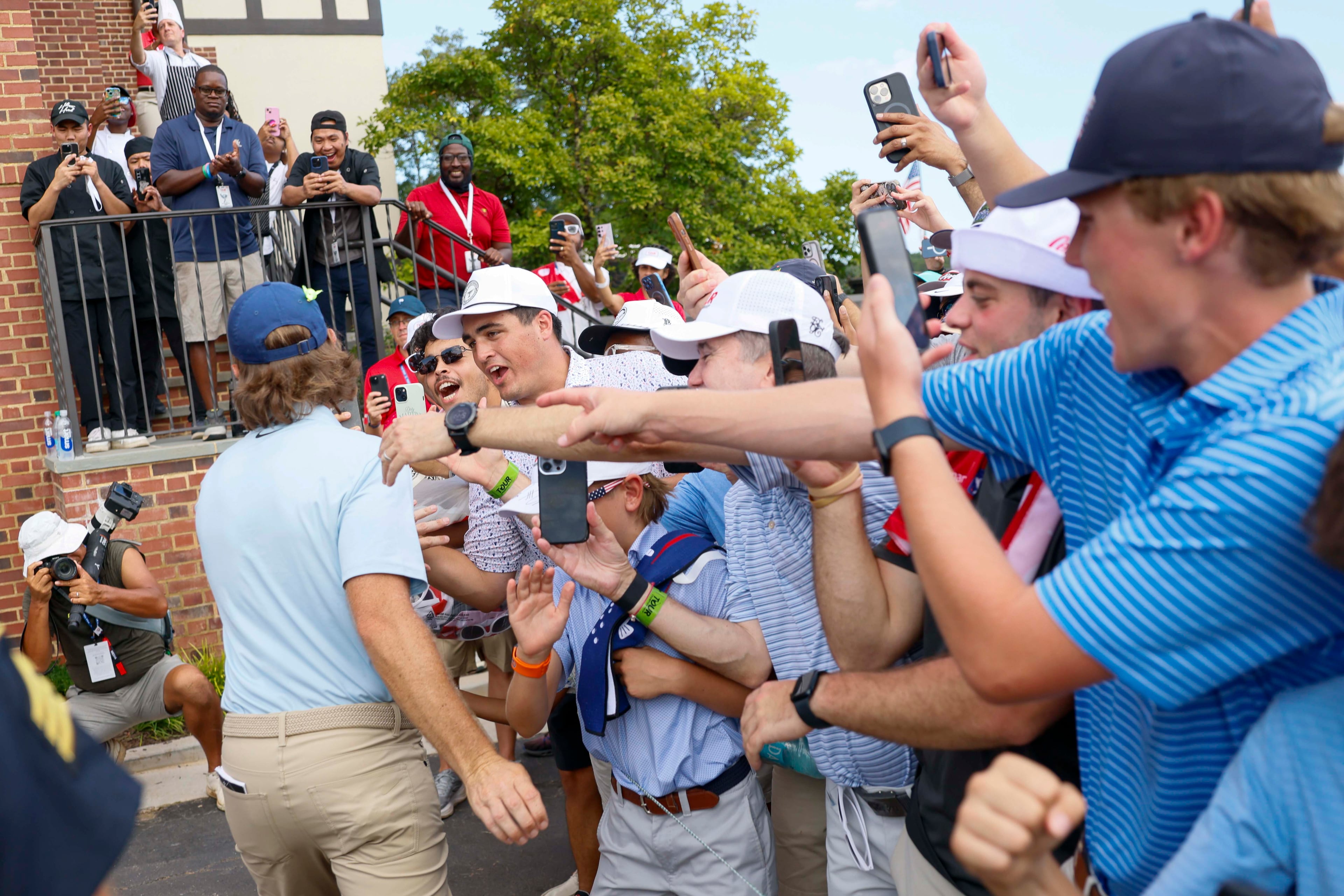 Fans congratulates Tommy Fleetwood, of England, after winning the PGA Tour Championship at East Lake Golf Club, on Sunday, Aug. 24, 2025, in Atlanta. (Miguel Martinez/ AJC)