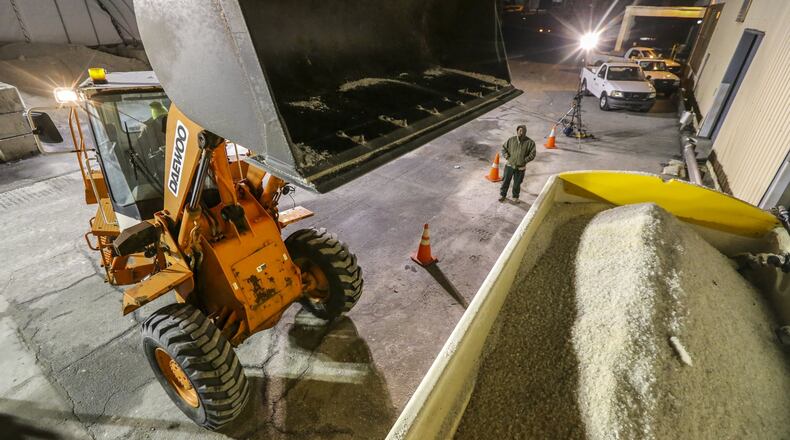 Highway crews, like this one from the Georgia Department of Transportation shown working last winter, add salt to brine makers. The resulting liquid is sprayed on highways in an attempt to prevent icy conditions. JOHN SPINK /JSPINK@AJC.COM