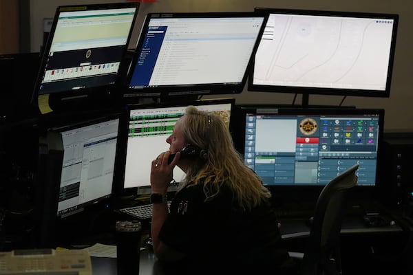 Dispatcher Donna Bocik responds to a 911 call at the Collier County Emergency Services Center, Friday, July 11, 2025, in Naples, Fla. (AP Photo/Marta Lavandier)