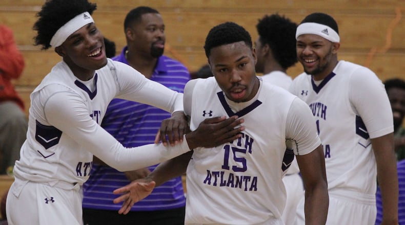 South Atlanta forward Tyler Thornton (15) receives a warm welcome from his team mates at the start of a game in Atlanta on Thursday, Jan. 12, 2017. (Henry Taylor/AJC)