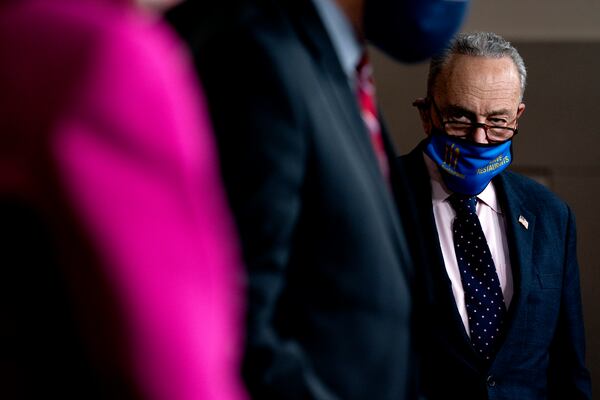 Senate Majority Leader Chuck Schumer, D-New York, listens during a news conference on the Equality Act. (Stefani Reynolds/The New York Times)