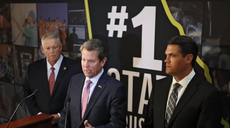 Gov. Brian Kemp, center, is flanked by Lt. Gov. Geoff Duncan, right, and House Speaker David Ralston during a press conference Monday, March 25, 2019. Bob Andres / bandres@ajc.com
