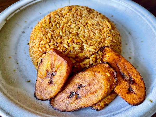 Smoky undertones come from cooking Little Lagos' jollof rice over fire. (Angela Hansberger for the AJC)