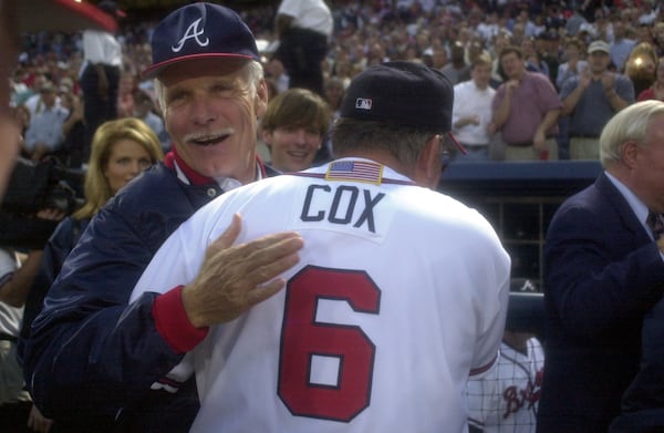 Longtime Braves owner Ted Turner congratulates manager Bobby Cox on his team's win following the Braves 6-2 win versus the Houston Astros in game 3 of the division series on Friday, 10/12/01. The Braves go to the National League Championship Series next week. (Marlene Karas/AJC File)
