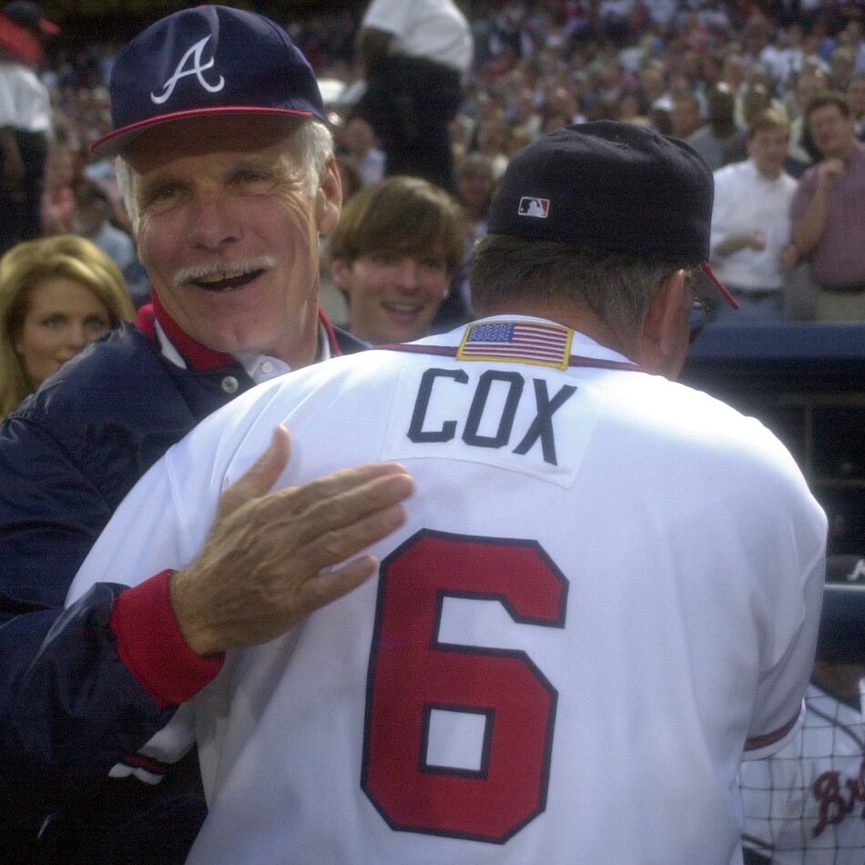 Longtime Braves owner Ted Turner (back) congratulates manager Bobby Cox on a win in the 2001 National League Division Series. (Marlene Karas/AJC 2001)