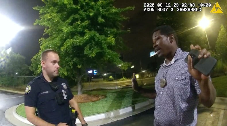 This screen grab taken from body camera video provided by the Atlanta Police Department on June 12, 2020, shows Rayshard Brooks, right, speaking with Officer Garrett Rolfe in the parking lot of a Wendy's restaurant, prior to being fatally shot by Rolfe. (Atlanta Police Department/Zuma Press/TNS)