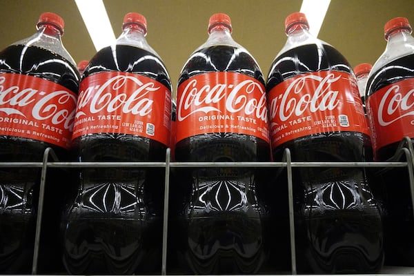 Bottles of Coca-Cola are displayed at a grocery store in Mount Prospect, Ill., Thursday, July 17, 2025. (AP Photo/Nam Y. Huh)