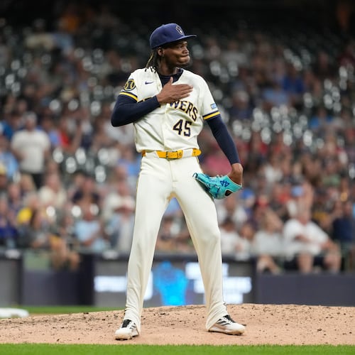 Milwaukee Brewers' Abner Uribe gestures during the eighth inning of a baseball game against the St. Louis Cardinals, Tuesday, May 26, 2026, in Milwaukee. (AP Photo/Aaron Gash)
