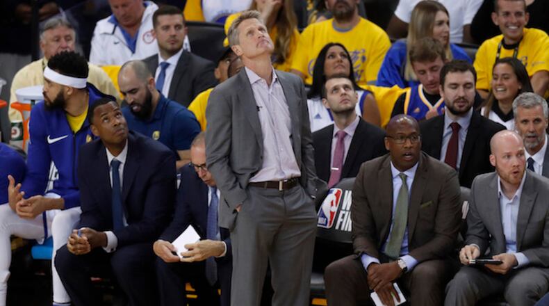 Golden State Warriors head coach Steve Kerr watches the television monitor after a foul was called against his team during Game 3 of NBA Western Conference finals  against the Houston Rockets on May 20, 2018, at Oracle Arena in Oakland, Calif. (Nhat V. Meyer/Bay Area News Group/TNS)