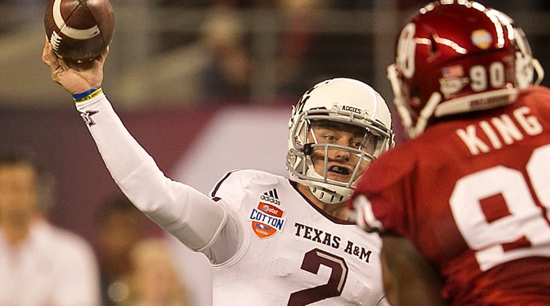 Texas A&M's Johnny Manziel (2) throws downfield against Oklahoma during the first half of the 77th AT&T Cotton Bowl Classic held at the Cowboy Stadium in Arlington, Texas, on Friday, January 4, 2013. Rodolfo Gonzalez / Austin American-Statesman