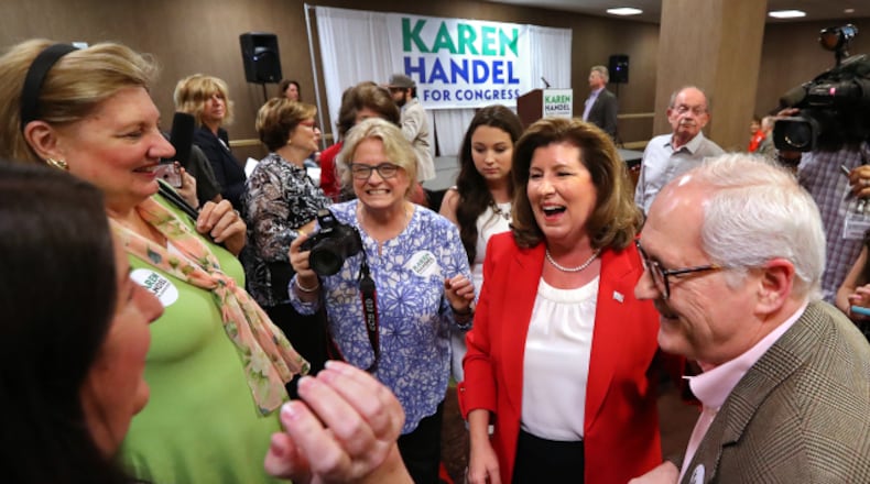 Then-candidate Karen Handel works a room full of supporters during her election night viewing party in April. Curtis Compton/ccompton@ajc.com