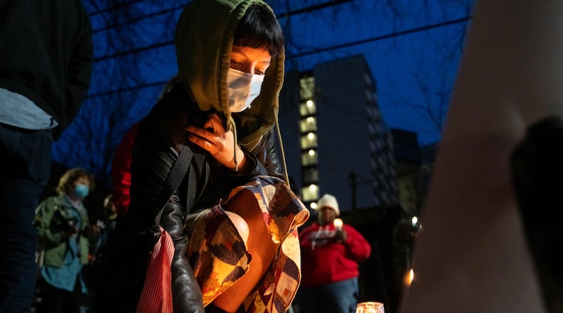 Locals gather Friday to mourn the passing of a local homeless man who was killed during a city encampment clearing operation on Thursday, Jan. 16, 2025. (Ben Hendren for the Atlanta Journal-Constitution)