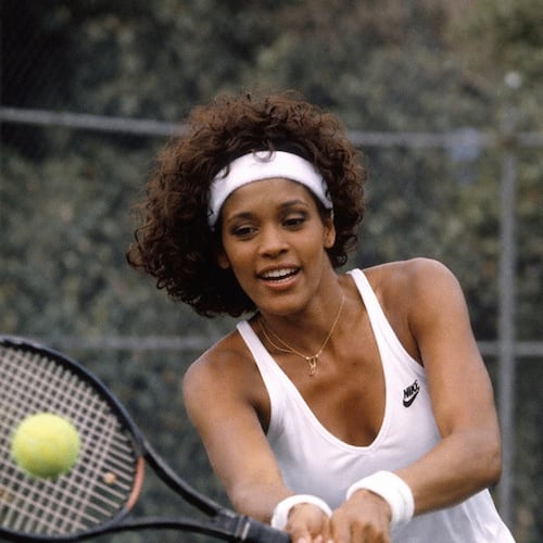 Singer Whitney Houston playing tennis. The Whitney E. Houston Legacy Foundation and Primary Wave Music plan the first Annual Whitney E. Houston Pickleball Tournament in Alpharetta. (Courtesy of The Estate of Whitney E. Houston)