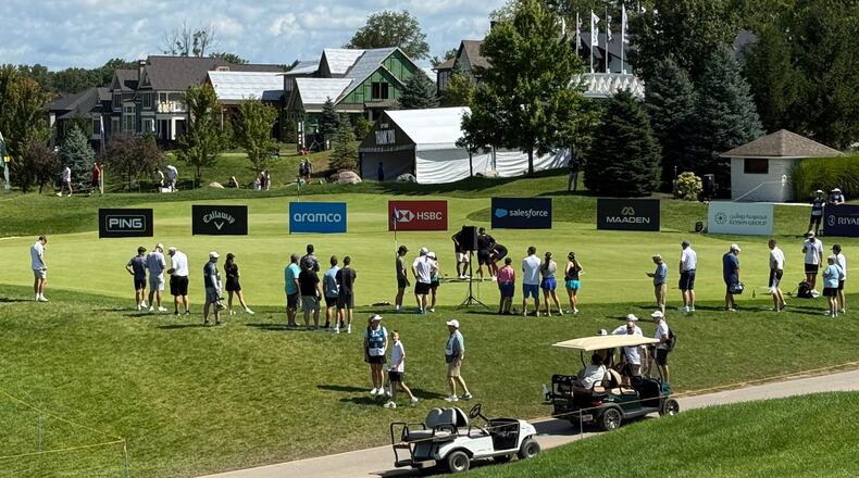 LIV Golf fans gather at the practice putting green before the final round of the season-ending event in suburban Indianapolis, Ind., Sunday, Aug. 23, 2026. (AP Photo/Michael Marot)