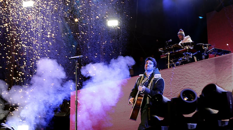 EDM-pop duo, The Chainsmokers, Andrew Taggert amidst the fireworks on guitar as Alex Pall commands the electronics, headlined the second day of the AT&T Playoff Playlist Live! concert series pre-game celebrations at Centennial Olympic Park on Jan. 7, 2018. (Akili-Casundria Ramsess/Eye of Ramsess Media)