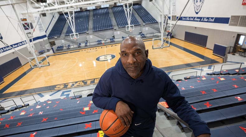 Keith Legree, the star player on the Statesboro high school’s 1991 State Championship team, has returned to take the place of his mentor coach Lee Hill. Hill’s death of COVID-19 in August 2020 has rocked the city and brought an end to his 44-year career at the school. (AJC Photo/Stephen B. Morton)