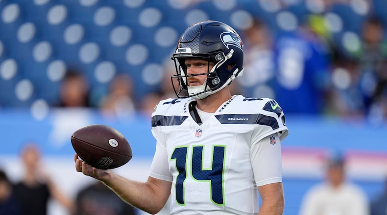 Seattle Seahawks quarterback Sam Darnold warms up before a preseason NFL football game against the Tennessee Titans, Sunday, Aug. 23, 2026, in Nashville, Tenn. (AP Photo/George Walker IV)