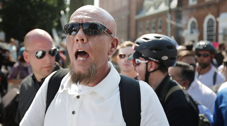 CHARLOTTESVILLE, VA - AUGUST 12: White nationalists, neo-Nazis and members of the "alt-right" exchange insults with counter-protesters as they enter Emancipation Park during the "Unite the Right" rally August 12, 2017 in Charlottesville, Virginia. After clashes with anti-fascist protesters and police the rally was declared an unlawful gathering and people were forced out of Emancipation Park, where a statue of Confederate General Robert E. Lee is slated to be removed. (Photo by Chip Somodevilla/Getty Images)