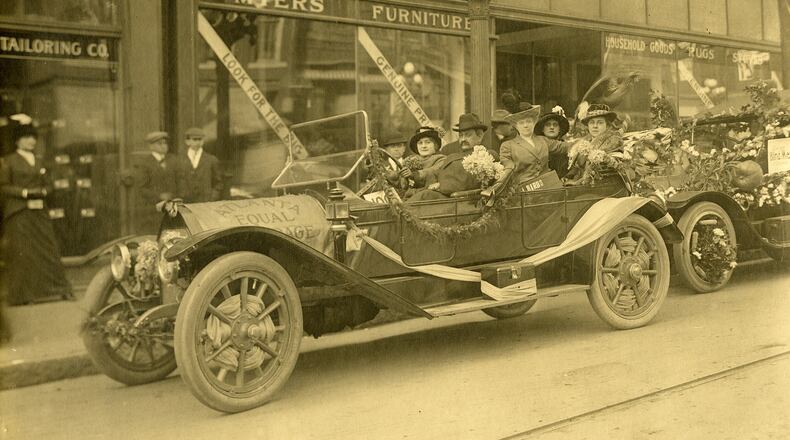 View of the Atlanta equal suffrage float in a 1913 civic parade in Atlanta, Georgia, with (front, left to right) Mamie Matthews, Eli A. Matthews, (back, left to right) Amelia R. Woodall, Margaret Koch, and Kate Koch. The car pictured was probably manufactured by Stevens-Duryea. (Kenan Research Center at the Atlanta History Center / used with permission)