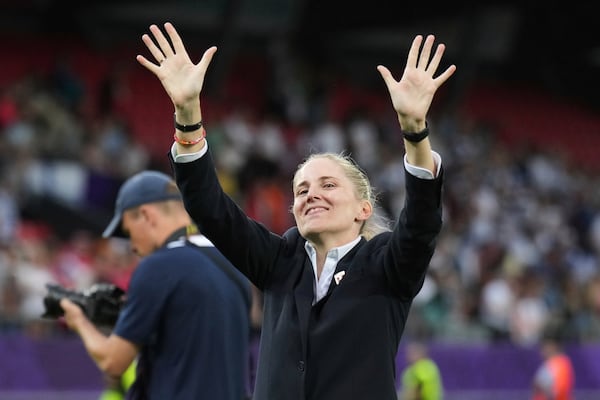 FILE - Norway head coach Gemma Grainger waves to the supporters at the end of the Euro 2025, group A, soccer match between Norway and Finland at Stade de Tourbillon in Sion, Switzerland, Sunday, July 6, 2025. (AP Photo/Alessandra Tarantino, File)